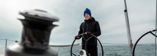 Guy on sailboat in cold weather